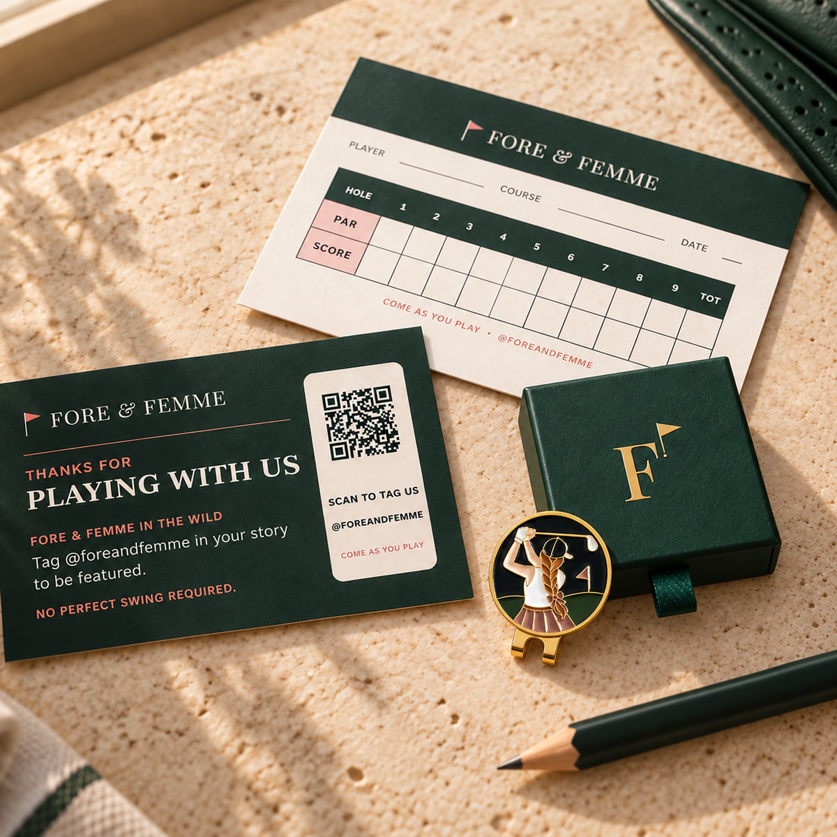 The Follow Through golf ball marker in its Fore & Femme gift box