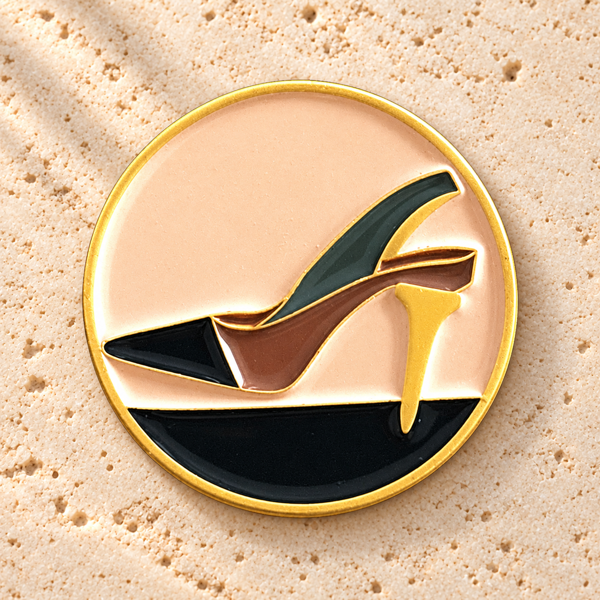 The Tee Heel golf ball marker, gold-plated enamel by Fore & Femme