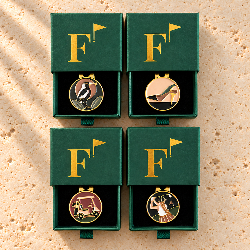 The Fairway Classics Foursome: four Fore & Femme golf ball markers in green gift boxes