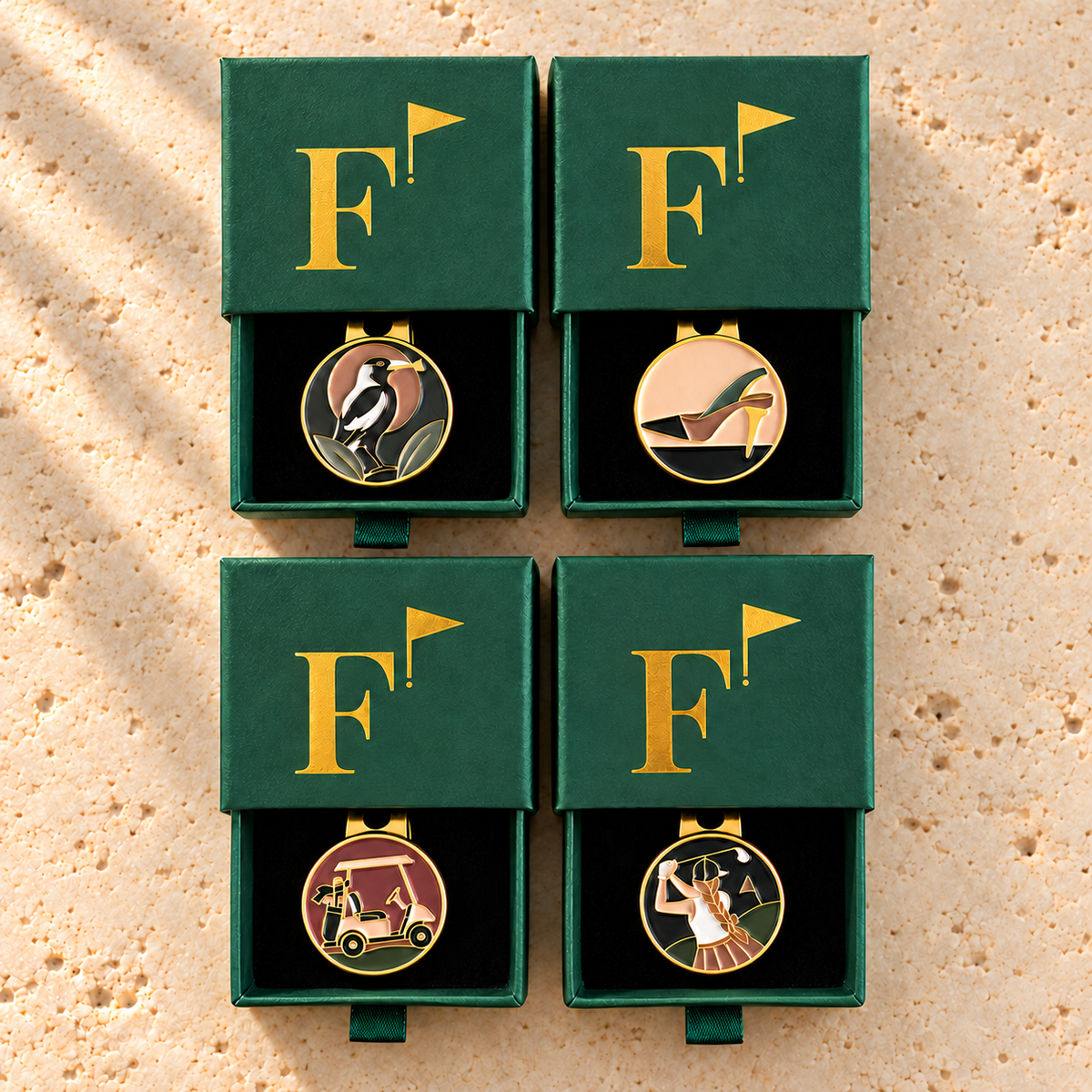 The Fairway Classics Foursome: four Fore & Femme golf ball markers in green gift boxes
