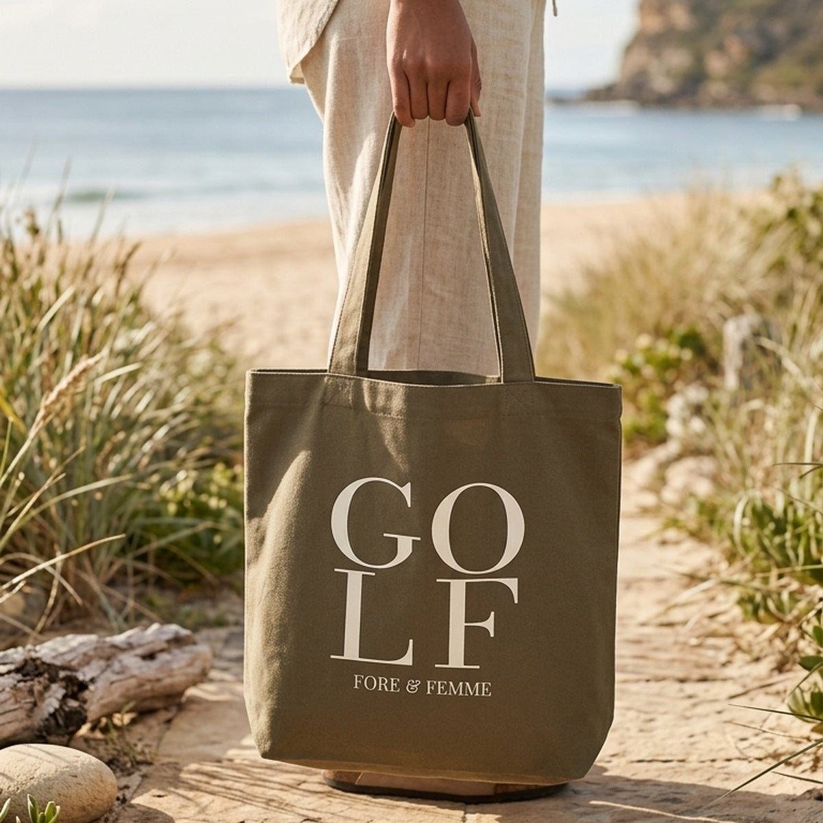 The Clubhouse Tote, a heavyweight walnut canvas golf tote bag with GOLF wordmark print by Fore & Femme
